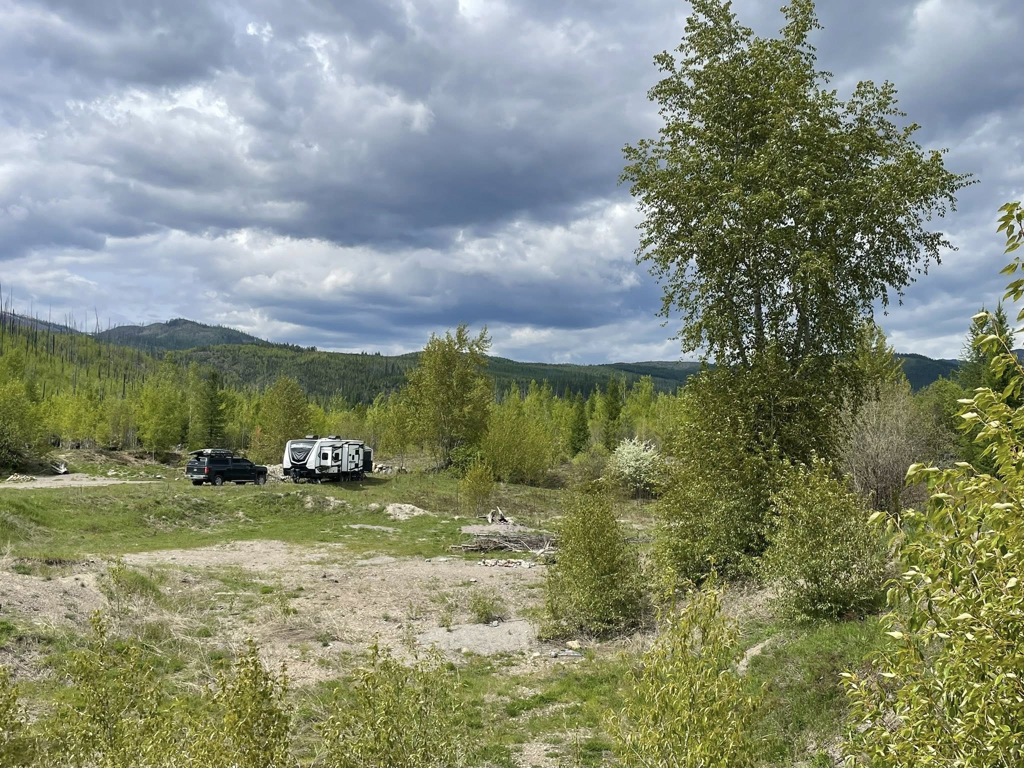 Rachel and Jeremy's truck and RV parked near Glacier National Park